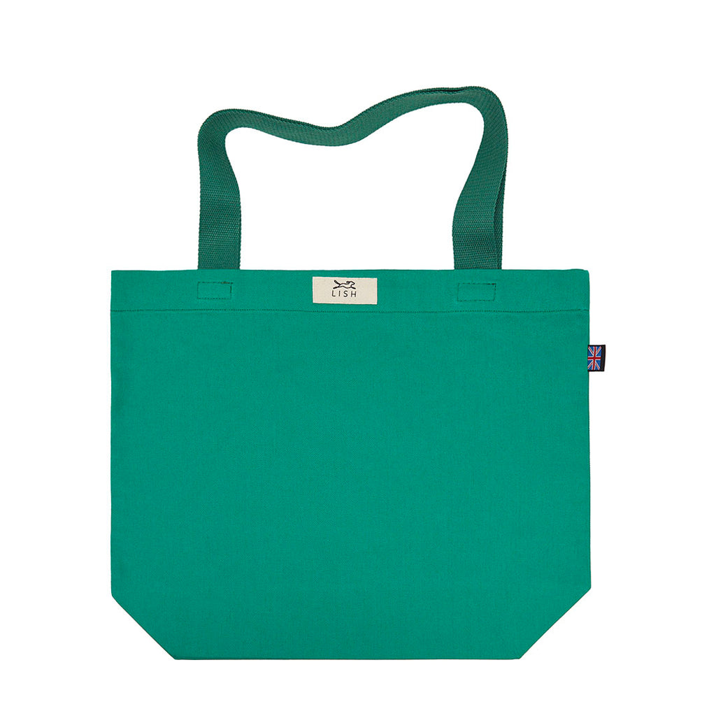 Hand cut and crafted in our London studio. Made from 100% cotton, perfect for day trips, picnics, sleepovers or just popping out. Green designer tote bag