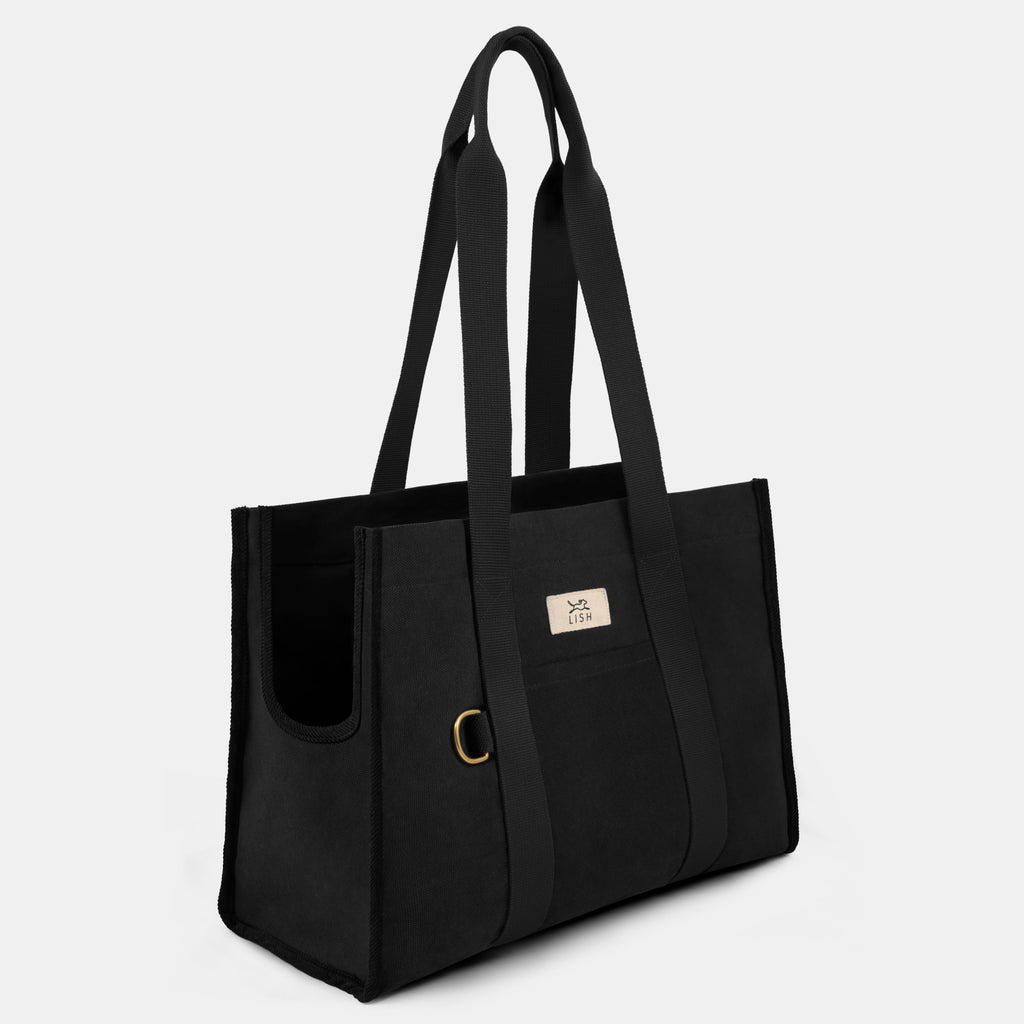 uxury designer black tote dog carrier, made in London,  England by British heritage designer brand LISH, in certified black cotton and Dring and pocket outer and inside for keeping valuables and everyday pet essentials in 