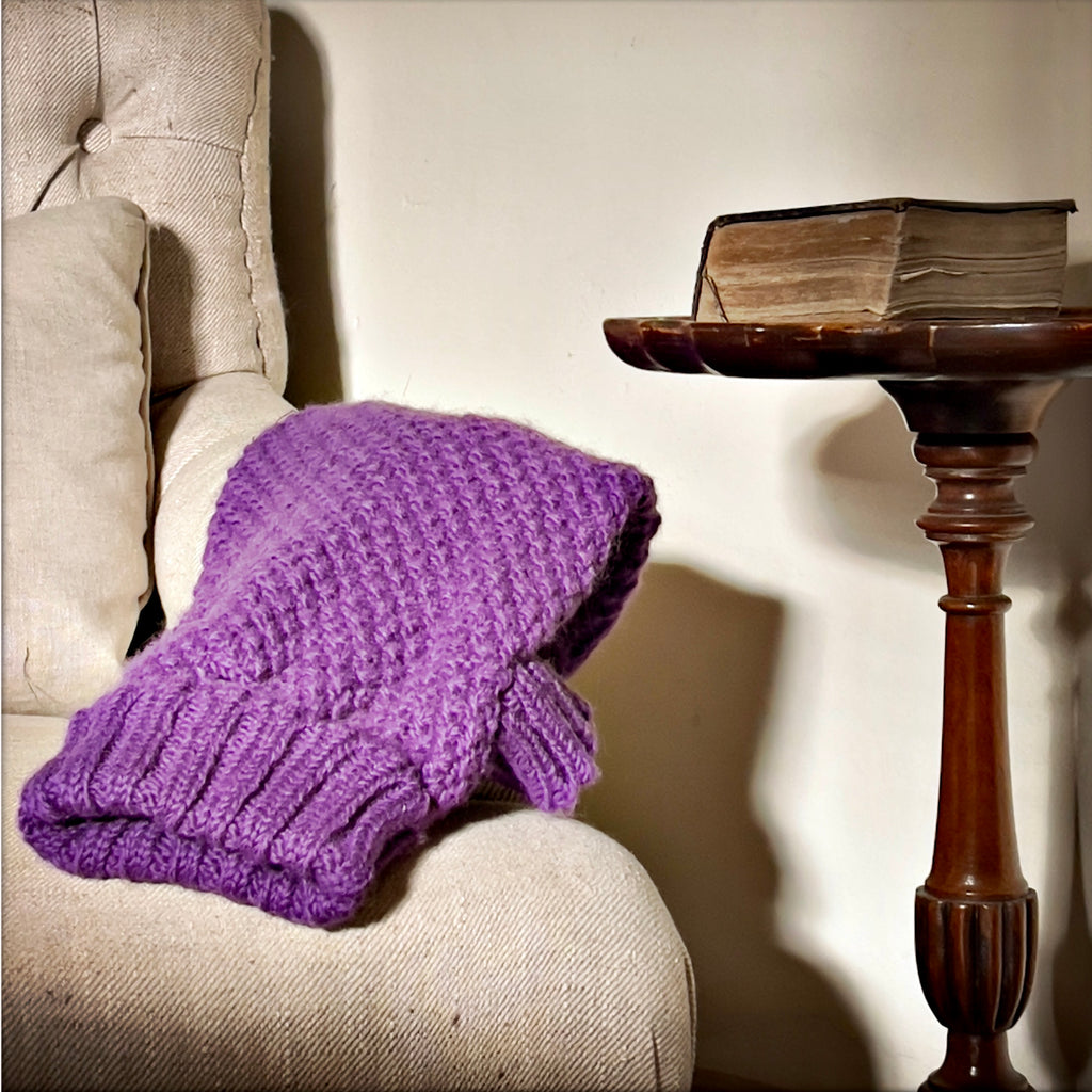 PURPLE REAL WOOL DOG JUMPER AND PURPLE REAL WOOL DOG SWEATER ON AN ARMCHAIR IN ENGLISH HERITAGE LUXURY PETWEAR BRAND LISH