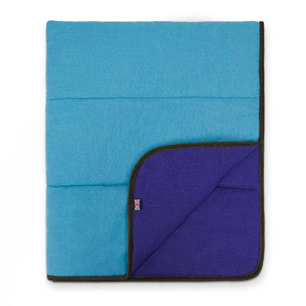 Dozing dogs love squishing up to something soft and snuggly, so Lilly designed this with their happiness in mind. Handcrafted in pure linen for the most luxurious duvet days ever. Your dog won’t want to get out of bed in the morning! Luxury designer Padbury Linen Teal Blue & Blueberry Purple Luxury Reversible Dog Duvet teal blue with blueberry purple fold and union jack, with dust gift bag and vegan friendly pet gift, recycled quilting