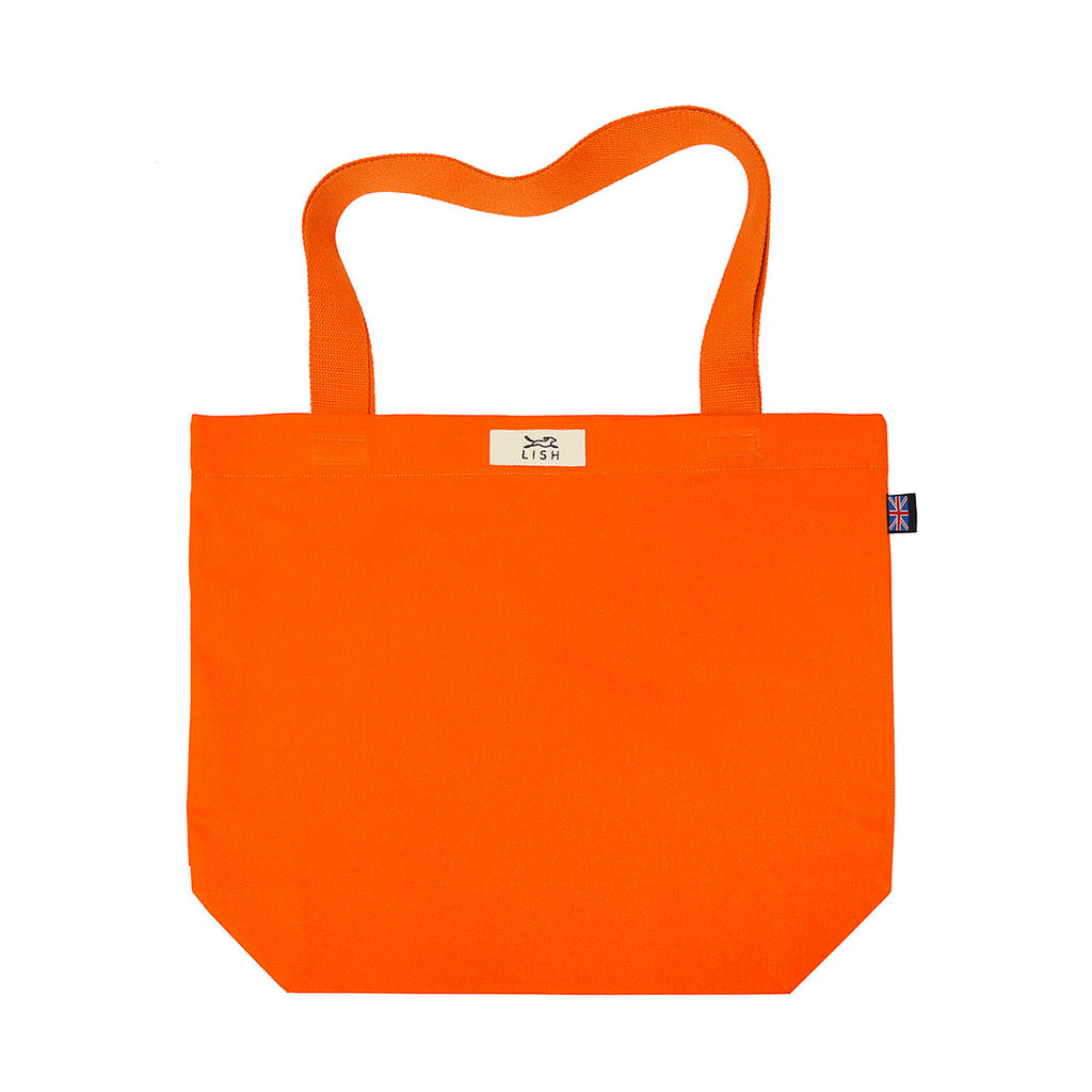 Hand cut and crafted in our London studio. Made from 100% cotton, perfect for day trips, picnics, sleepovers or just popping out. Orange designer tote bag