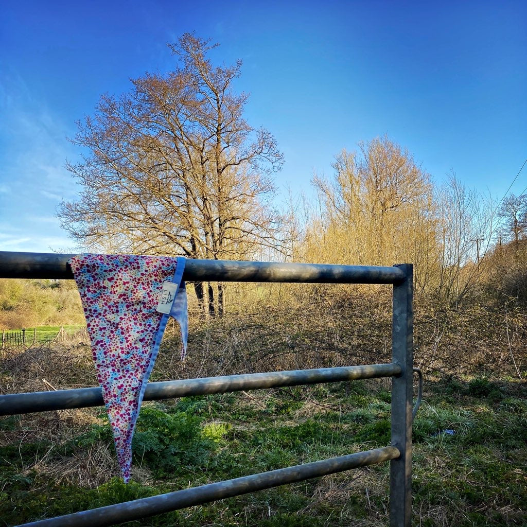 Liberty print bandana on a field gate in the british countryside made and handcrafted by LISH luxury sustainable petwear 